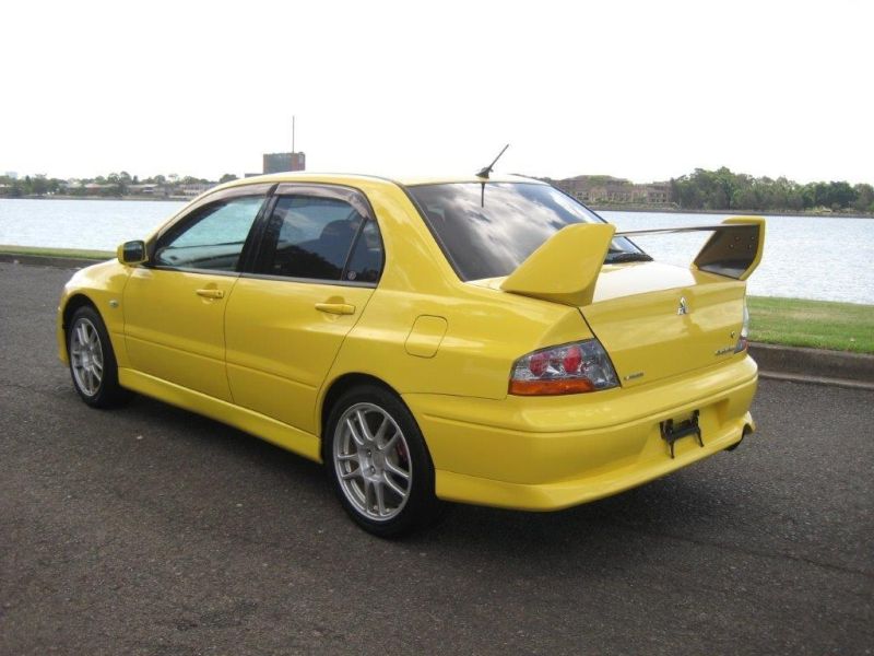 2003 Mitsubishi Lancer EVO 8 GSR yellow left rear