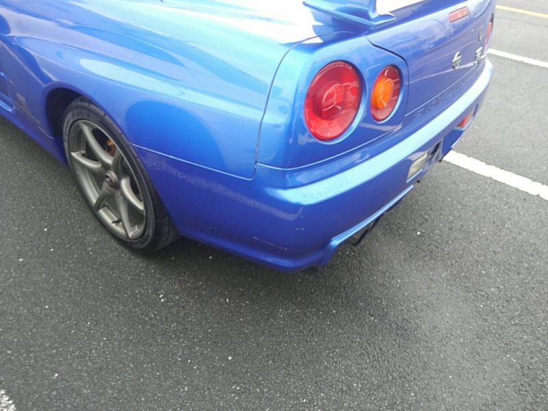 1999 Nissan Skyline R34 GT-R VSpec TV2 Bayside Blue left rear bumper